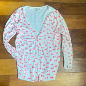 Off-white cardigan with neon coral bicycle pattern